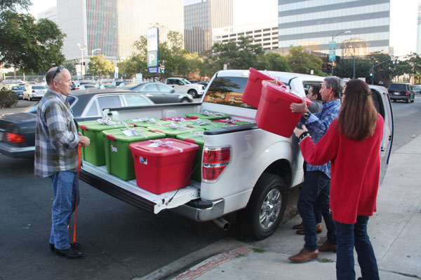 loading gift boxes to deliver to Toussaint Academy