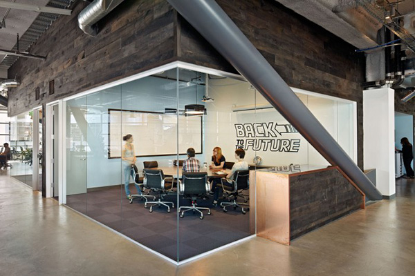 Glass walled conference rooms provide quiet space for teams to focus, away from the hubbub of the open workspace.