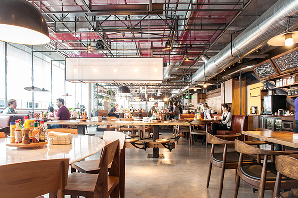 The rustic, light-filled cafeteria is a favorite spot for team members to recharge and refuel.